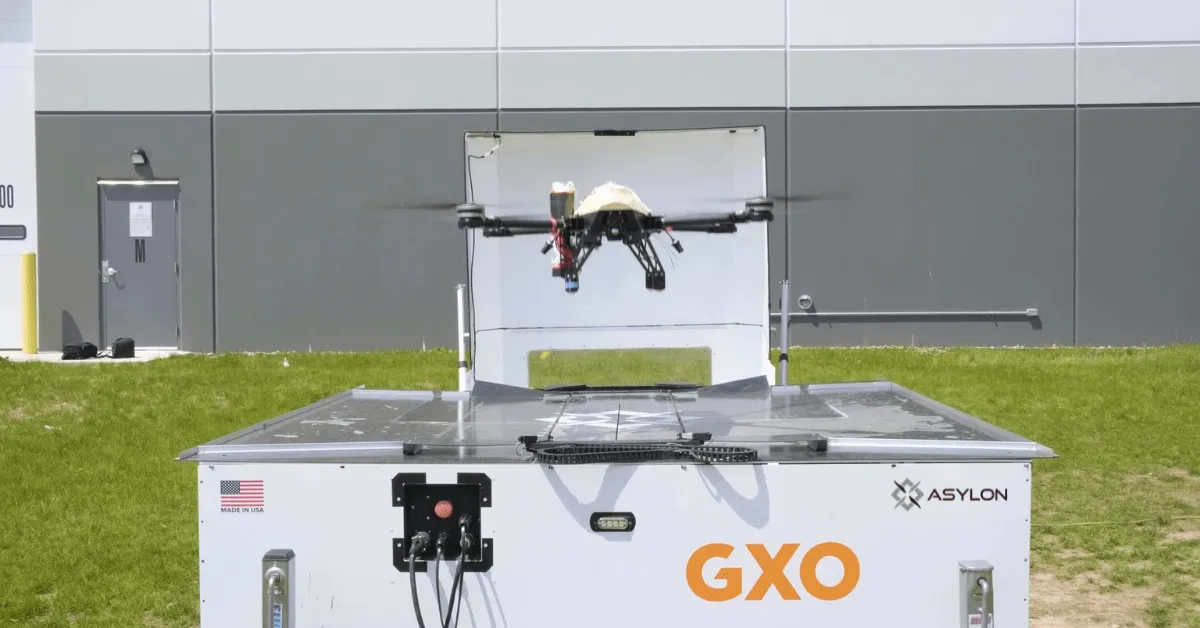 Asylon Guardian drone launching from DroneHome base station at GXO distribution center