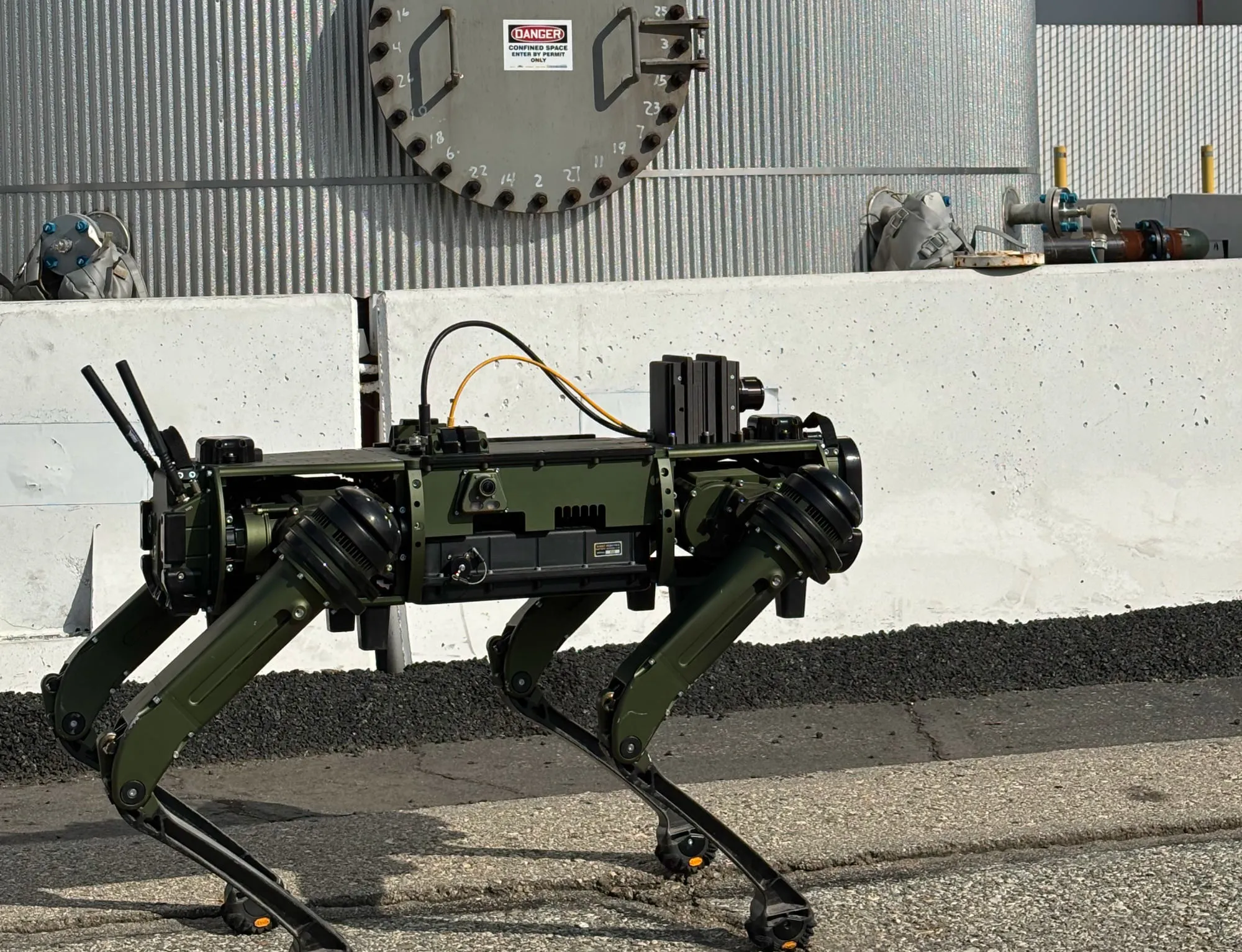 Autonomous security robot performing perimeter patrol of industrial facility